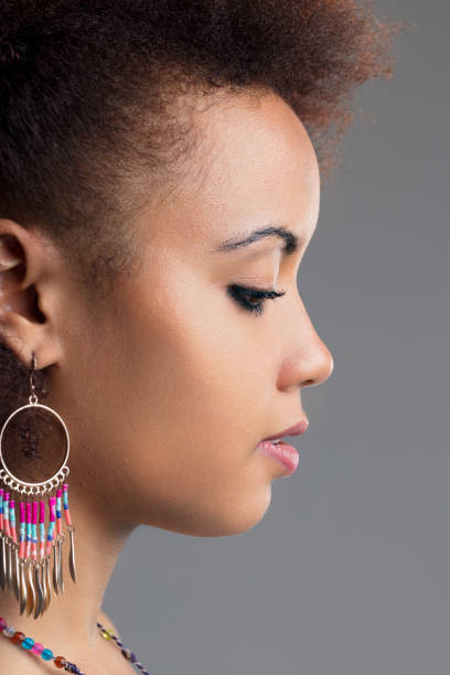 istock Thoughtful woman, profile adorned with beads 1887221288