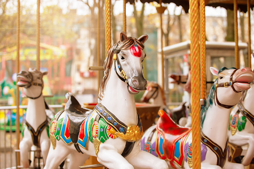 Vintage carousel horse in the sun. Childhood memories.