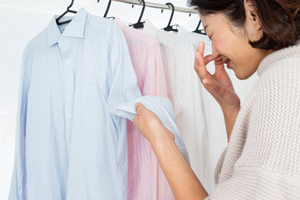 istock A woman hangs laundry in the bathroom. 1887290500