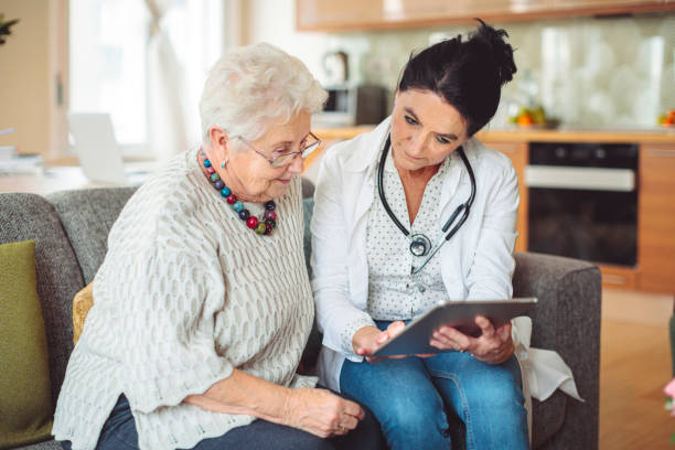 istock Social worker is visiting a senior woman 1887293179