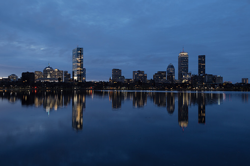 View across the Charles River of Boston's Back Bay neighborhood skyline at morning twilight, the first light of the day.