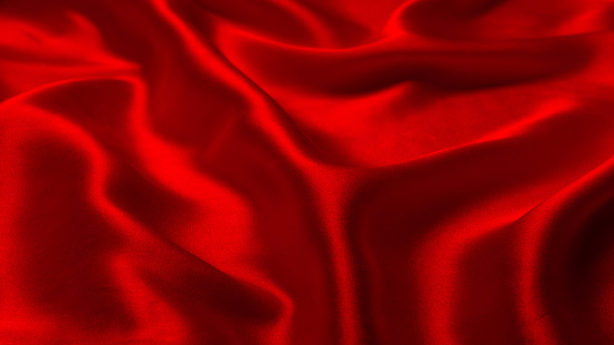 Red silk or satin luxury fabric texture can use as abstract background. Top view.