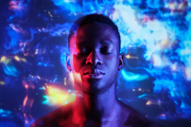 istock Emotionless shirtless black man with eyes closed in neon lights 1887365816