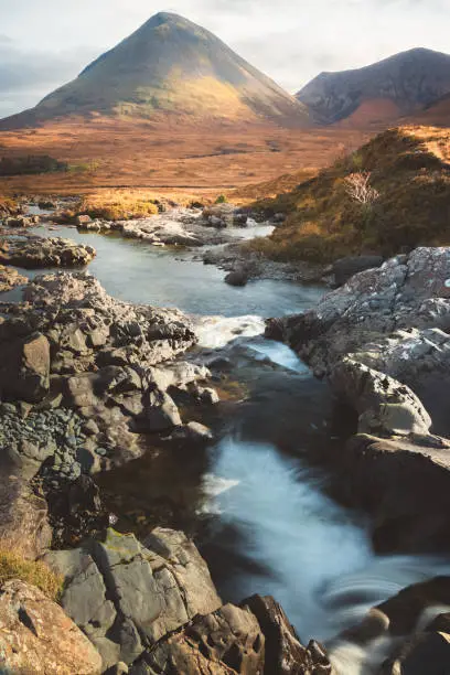 Scenic landscape view of the Glamaig peak in  Red Cuillin mountains and Sligachan waterfall on the Isle of Skye, Scottish Highlands, Scotland.