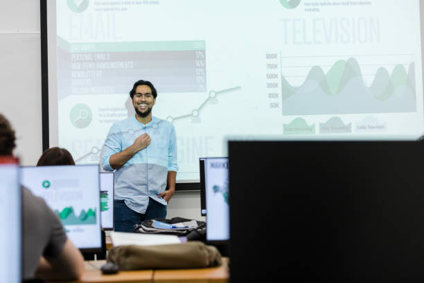 istock Cheerful male college lecturer teaches computer graphics class 1887375687