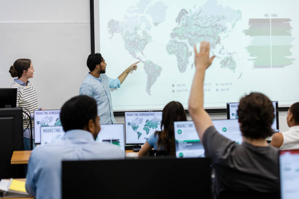 istock Unrecognizable student asks question during global marketing seminar 1887375692