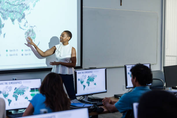 istock Female university professor teaches global marketing class 1887375707