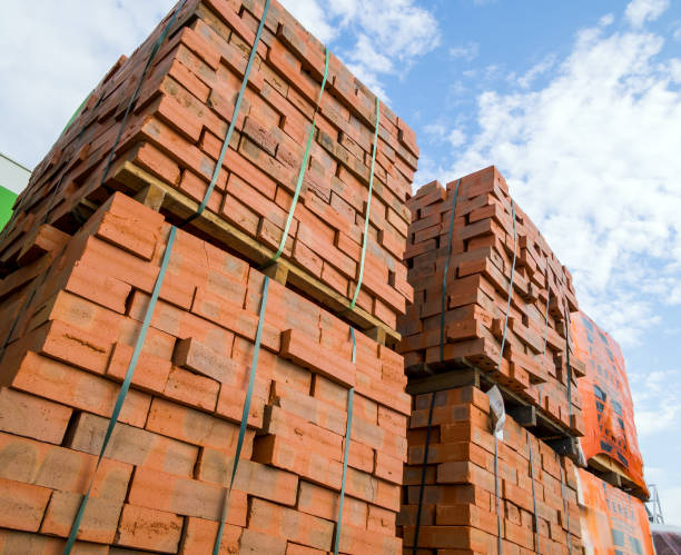 istock Packing with solid red bricks against the background of the sky 1887388279