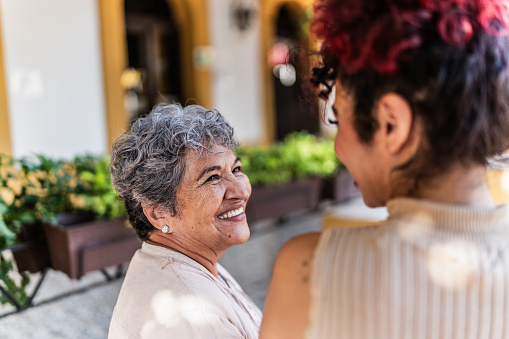 Close up of mature Mexican lady looking at the camera. Mature latina woman looking at the camera. serious attitude.