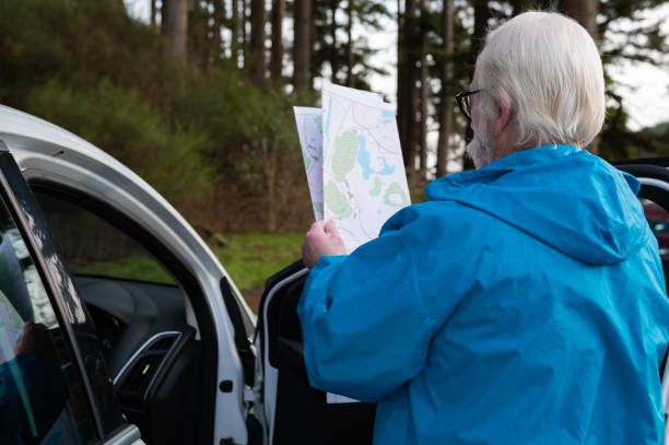 istock Rear view of a retired man looking at his map 1887417830