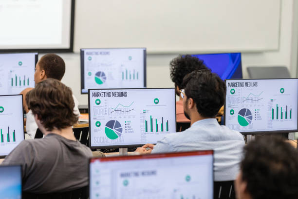 istock Diverse group of students sit at their computers in the lab 1887419884