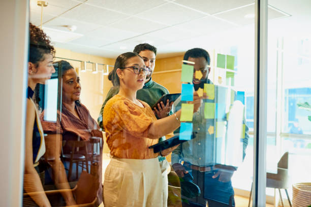 istock Diverse Professionals Brainstorming Ideas in Modern Office 1887444246