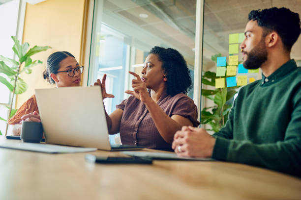 Diverse Professionals Brainstorming Ideas In Modern Office