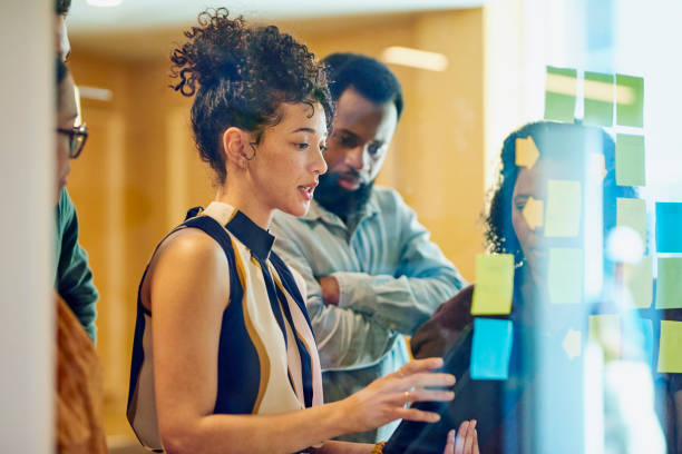 istock Diverse Professionals Brainstorming on Glass Wall 1887444773