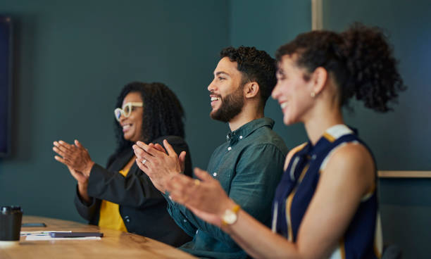 istock Diverse Business Professionals Applauding in Agreement During Creative Meeting 1887448540