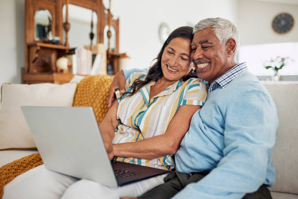 istock Happy Mature Couple Using Laptop At Home 1887467522