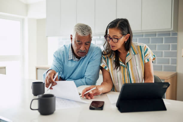 istock Senior couple reviewing finances 1887469209