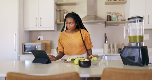 istock Young Woman Cooking In Kitchen 1887470321