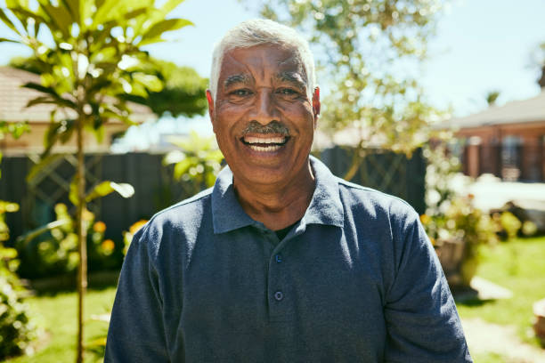 istock Smiling elderly man in a garden 1887471439