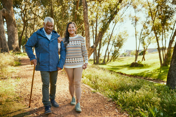 istock Happy Couple Walking in the Park on a Sunny Day 1887472010