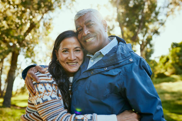istock Smiling elderly man in a blue jacket standing in a field 1887472034
