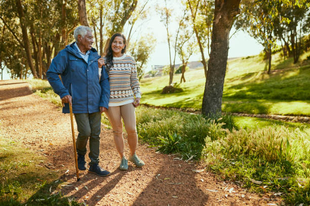 istock Happy Couple Walking in the Park 1887472041