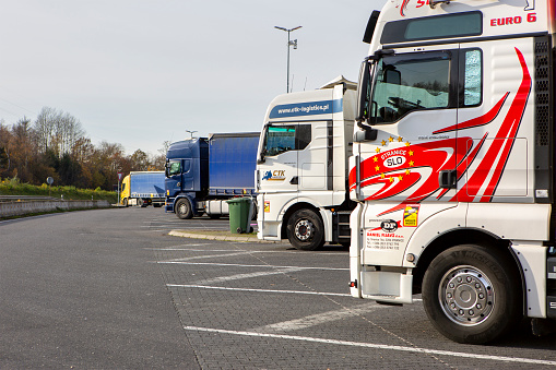 Montabaur, Germany - November 22, 2023: Parked trucks on German rest area Montabaur. Many rest areas are completely overloaded due to the high truck traffic density in Germany