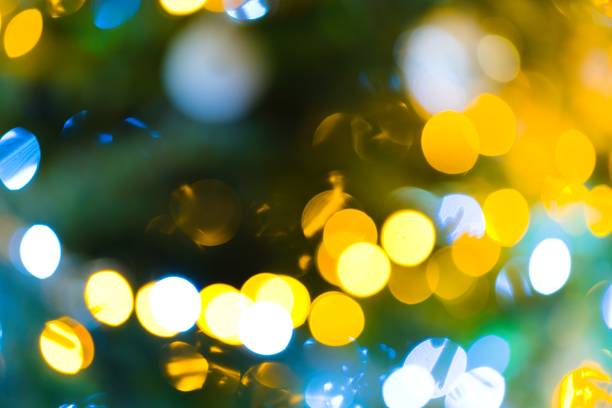 istock A mesmerizing image captures the enchanting glow of blurred lights on a Christmas tree, creating a warm and festive ambiance. 1887579523