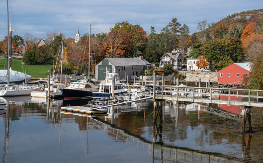 Fall colors decorate the waterfront at a small coastal town in Maine.