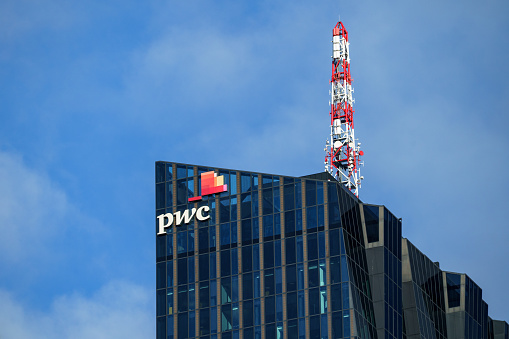 Vienna, Austria - 14 December 2023: Skyscraper of the headquarters of PWC Austria - one of Austria's leading consulting companies