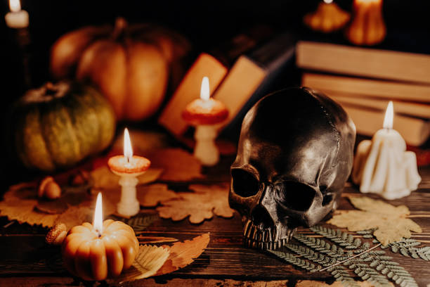 istock Mystique background - bronze human skull with candles. Visual gothic aesthetic. 1887665585
