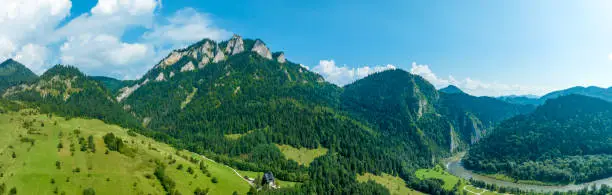 Poland. Pieniny Mountains with  the highest summit Trzy Korony (There Crows) and the beginning of the Dunajec River Gorge and Slovakia on the right. Wide aerial drone panorama