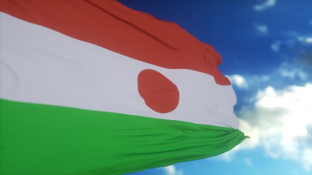 Niger flag waving in the wind. National flag of Niger, Africa