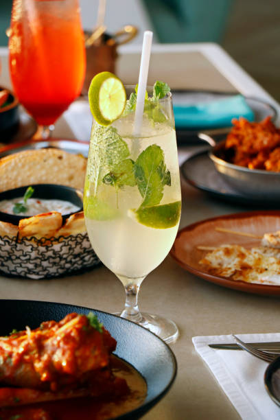 istock alcohol cocktail drinks paired with foods on a table 1887719093