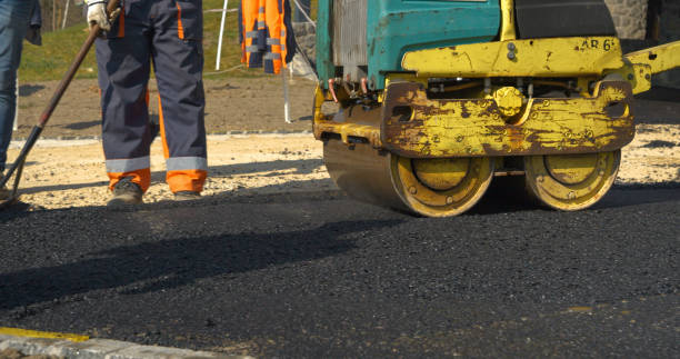 istock Working with asphalt roller for compacting and smoothing surface at driveway 1887723730