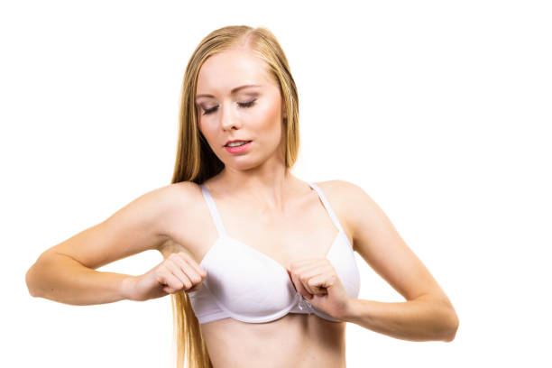 istock Female wearing too big bra 1887811506