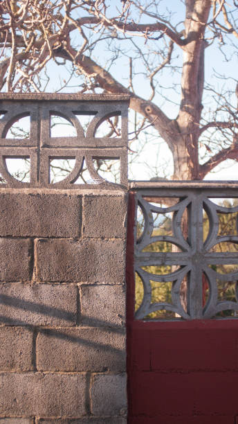 istock Cross and circle in concrete fence 1887882882