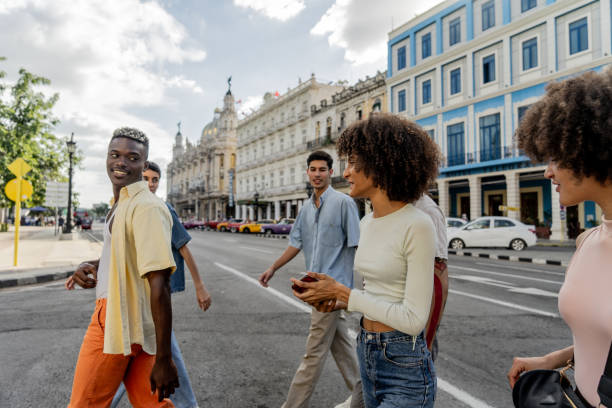 istock Friends talking while walking through the city 1887887624