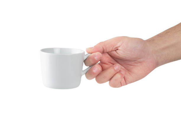 istock Man hand holding white ceramic cup on white background 1887891729