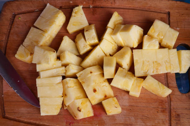 istock top view of cutting pineapple on a chopping board on table 1887898394