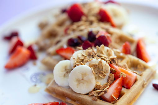 Waffles with syrup and strawberries