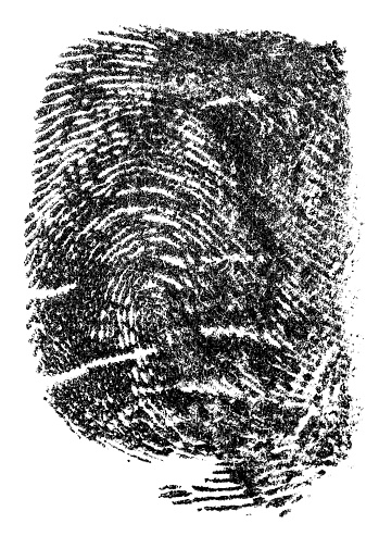 Single black fingerprint made with ink on a white background. Real fingerprint, top view.