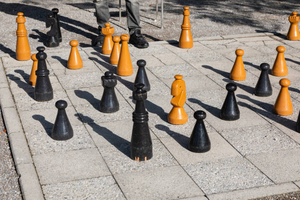 istock Giant chess set and figures in a city square 1887961406