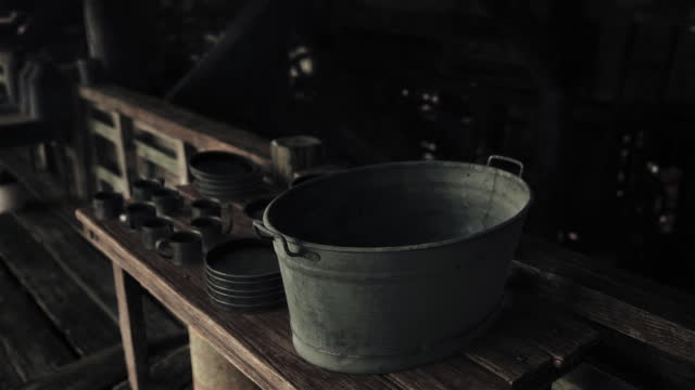 A bucket on a wooden table