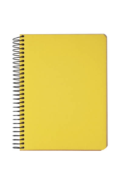 istock Closed spiral bound notepad with yellow cover isolated on white background 1887965048