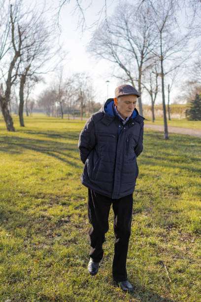 istock Senior man is enjoying a walk on autumn day. 1887967648