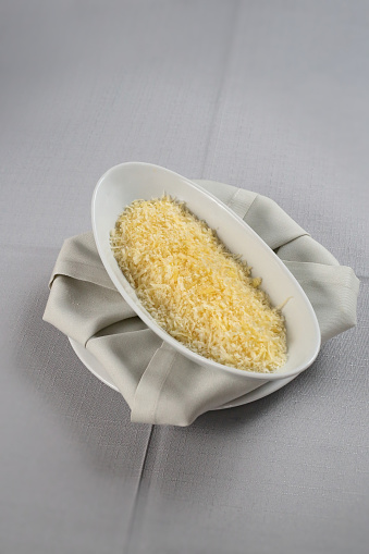 bowl with grated parmesan cheese