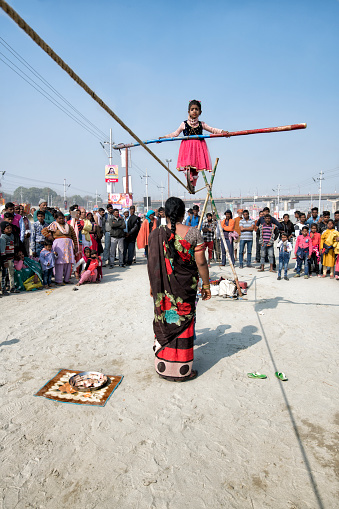 Hallahabad. India- january 14 2019: The Prayag Kumbh Mela, also known as Allahabad Kumbh Mela is a mela, or religious gathering, associated with Hinduism and held in the city of Prayagraj, India, at the Triveni Sangam, the confluence of the Ganges, the Yamuna, and the mythical Sarasvati river.[1] The festival is marked by a ritual dip in the waters, but it is also a celebration of community commerce with numerous fairs, education, religious discourses by saints, mass feedings of monks or the poor, and entertainment spectacle.[2][3] Approximately 50 and 30 million people attended the Allahabad Ardh Kumbh Mela in 2019 and Maha Kumbh Mela in 2013 respectively to bathe in the holy river Ganges, making them the largest peaceful gathering events in the world.[4][5]