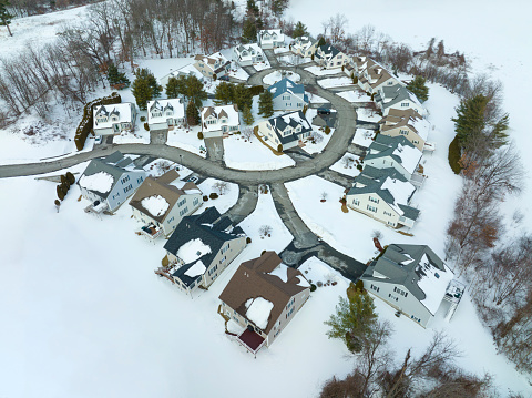 aerial view of residential community in winter after snow