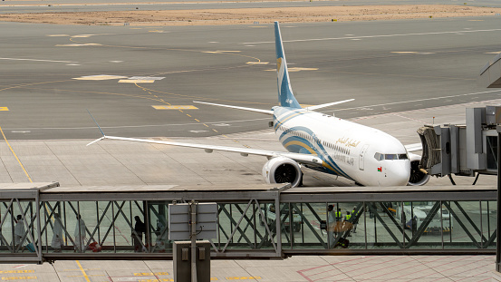 Muscat, oman- November 21,2023: oman air airplane getting ready to take off from muscat international airport